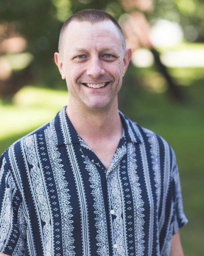 headshot photo of scott henkels